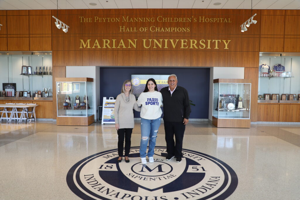 Tom and Chris Morales represent Manuel and Josefina Morales Endowment Scholarship to student recipient at Marian University.